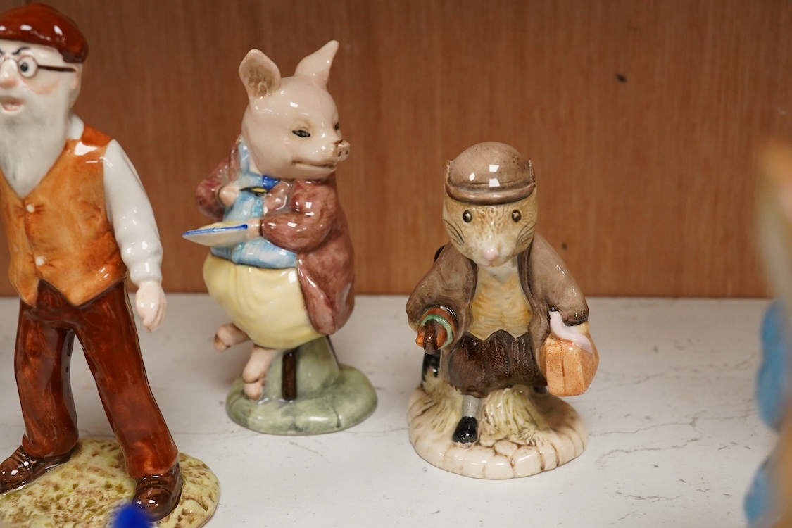 A collection of eighteen mixed Royal Doulton and Royal Albert figures of Beatrix Potter characters, largest 13cm high